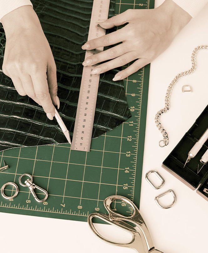 Close-up of leather craft process at Brahmin, showing craftsmanship and hands-on fashion production careers in luxury accessories.