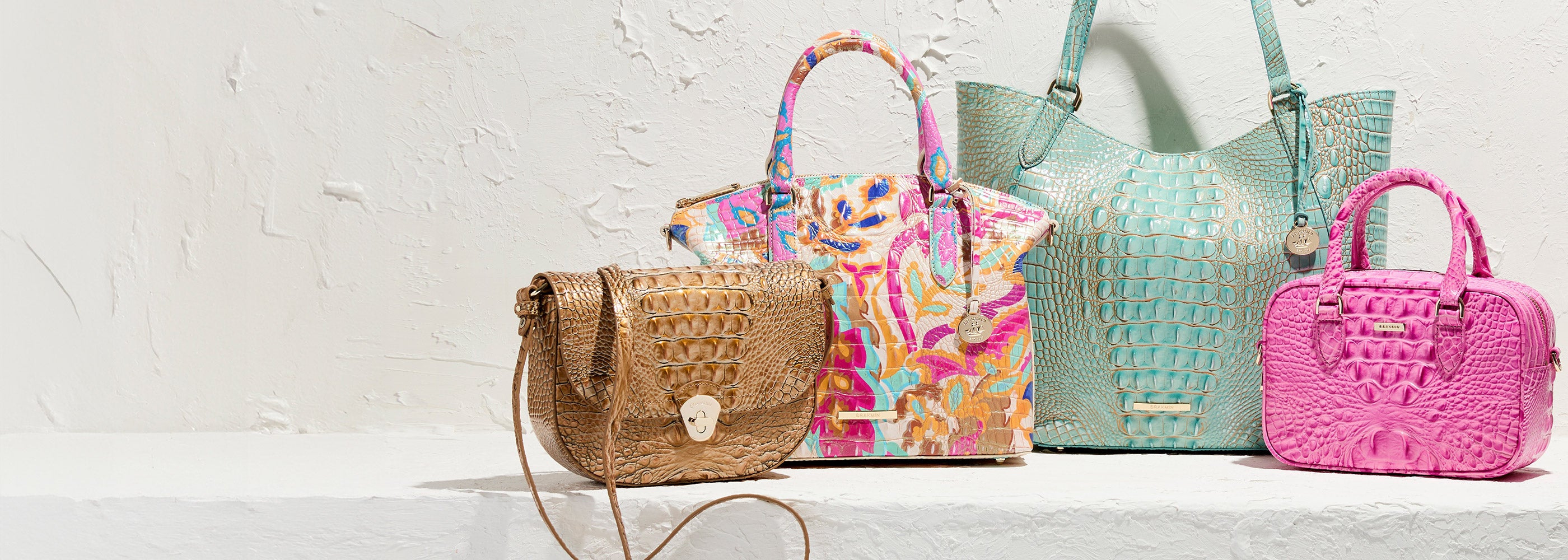 Collection of colorful handbags on a light background