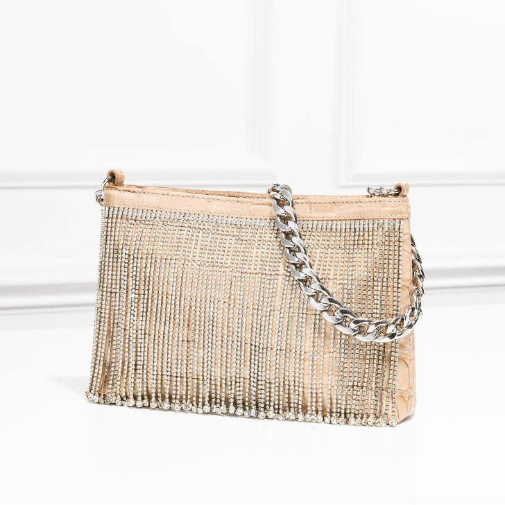 Champagne-colored leather clutch with crystal fringe detailing and silver chain strap, elegant evening handbag