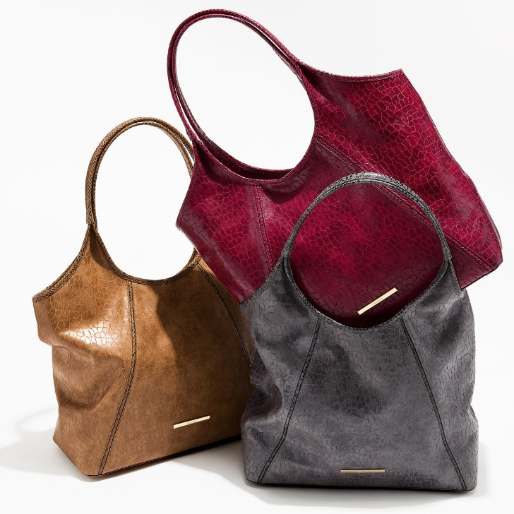 Soft slouchy leather tote bags in camel, burgundy, and gray with subtle textured finish